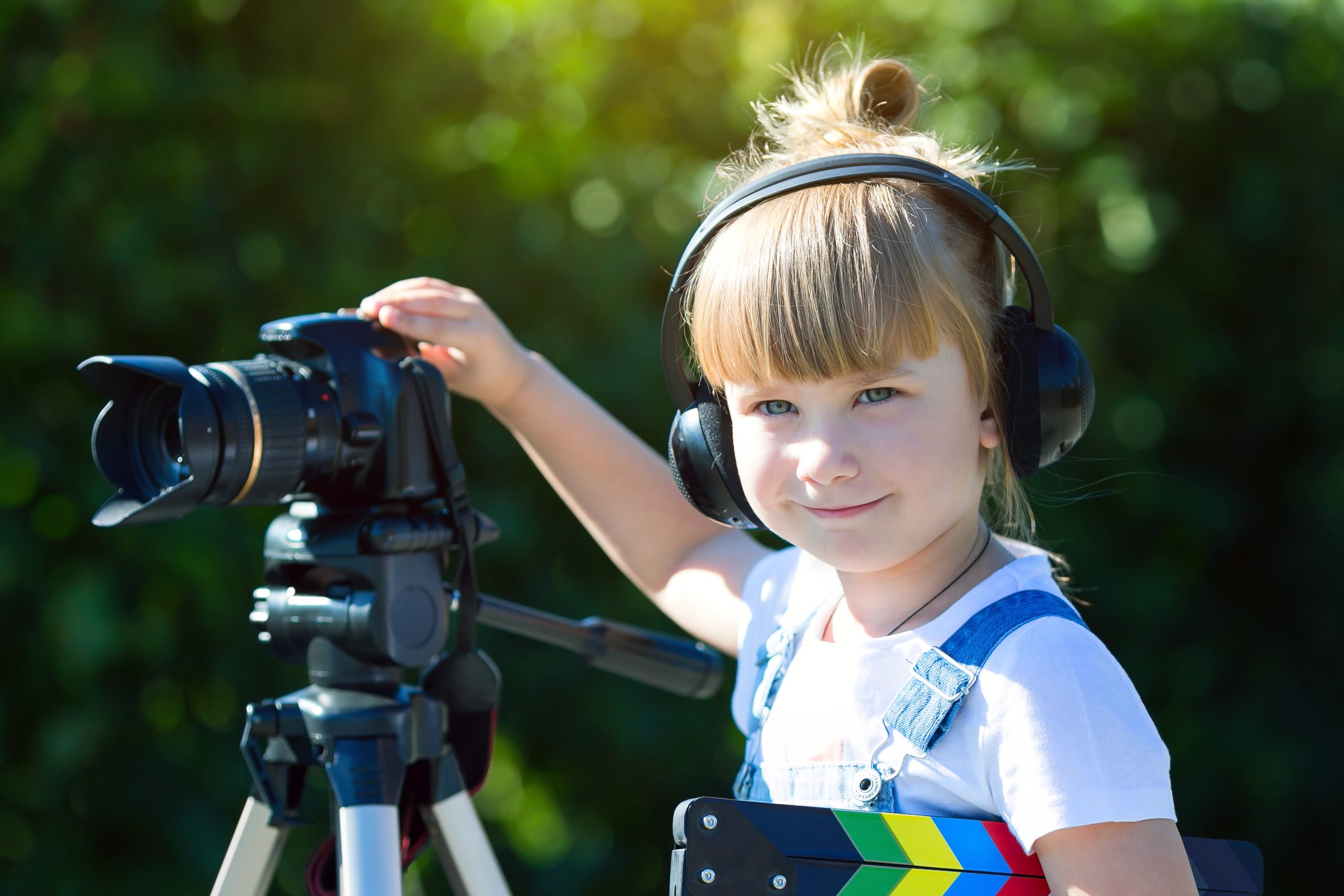 Portrait of a child with a TV clapper.